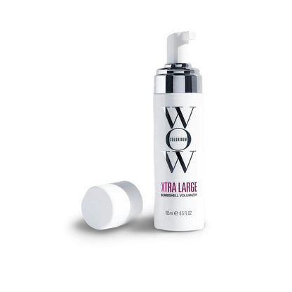 A White Color Wow Xtra Large Bombshell Volumizer bottle with 'WOW' branding on a white background