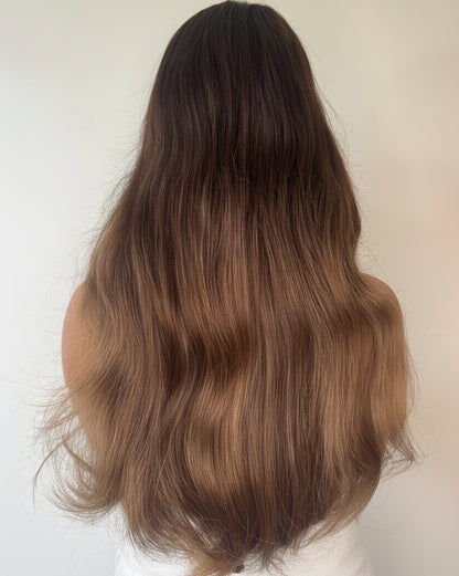 Brown hairpiece on a beige background